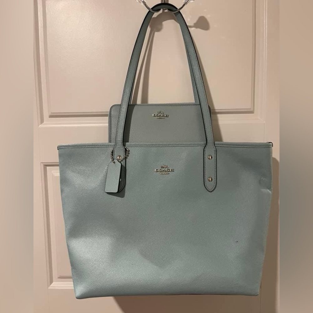 Light blue Coach bag and wallet.